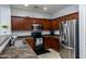 Well-lit kitchen featuring stainless steel appliances and ample cabinet space at 923 E Randy St, Avondale, AZ 85323