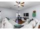 Inviting living room with a ceiling fan, hardwood floors, and lots of natural light at 923 E Randy St, Avondale, AZ 85323