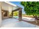 A covered back patio with stone columns overlooks a beautiful backyard and refreshing pool, perfect for outdoor relaxation at 9465 W Tonopah Dr, Peoria, AZ 85382