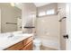 Bathroom featuring a vanity, toilet, shower, and bathtub combination at 9465 W Tonopah Dr, Peoria, AZ 85382