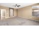 Spacious main bedroom with carpet and ensuite bathroom at 9465 W Tonopah Dr, Peoria, AZ 85382
