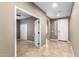 Open entryway features tile flooring and an open doorway to another room at 9465 W Tonopah Dr, Peoria, AZ 85382
