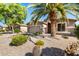 Home exterior featuring desert landscaping and a two-car garage at 9465 W Tonopah Dr, Peoria, AZ 85382