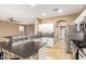 Bright kitchen with stainless steel appliances, mosaic tile backsplash, and tile floor at 9465 W Tonopah Dr, Peoria, AZ 85382