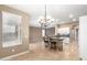 Open kitchen area with a stone-clad breakfast bar that flows into living area at 9465 W Tonopah Dr, Peoria, AZ 85382