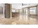 Spacious living room with tile floors and sliding glass doors leading to the outdoor area at 9465 W Tonopah Dr, Peoria, AZ 85382