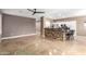Large living room with a kitchen bar and tile flooring at 9465 W Tonopah Dr, Peoria, AZ 85382
