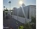 Exterior view with a grill and outdoor area, complemented by palm trees in the background at 303 S Recker Rd # 98, Mesa, AZ 85206