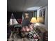 Small Living room features a cozy seating area with a blanket, lamp and unique skull decor at 303 S Recker Rd # 98, Mesa, AZ 85206
