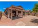 The backyard features desert landscaping, a covered patio, and space for dining and relaxing at 105 W Monona Dr, Phoenix, AZ 85027