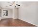 Bedroom with wood flooring, neutral walls, and window providing natural light at 105 W Monona Dr, Phoenix, AZ 85027