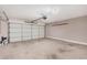 Spacious two-car garage featuring an automatic door, storage, and ample room for vehicles or hobbies at 105 W Monona Dr, Phoenix, AZ 85027