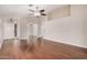 Spacious living room with a ceiling fan, neutral paint, and beautiful wood flooring at 105 W Monona Dr, Phoenix, AZ 85027
