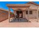 Covered patio with ceiling fan and outdoor dining set, perfect for entertaining or relaxing outdoors at 105 W Monona Dr, Phoenix, AZ 85027