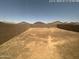 View of the flat and expansive, ready-to-landscape backyard at 13142 E Aster Ln, Florence, AZ 85132