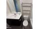 Cozy bathroom featuring sleek black vanity, toilet, sink, and white countertops at 13142 E Aster Ln, Florence, AZ 85132