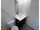 Clean bathroom with a modern vanity, sink, toilet, and neutral decor at 13142 E Aster Ln, Florence, AZ 85132