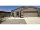 Charming single-story home featuring a two-car garage and low maintenance desert landscaping at 13142 E Aster Ln, Florence, AZ 85132