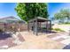 Outdoor space with gazebo and a decorative stone water feature enhancing the backyard at 14436 W Ventura St, Surprise, AZ 85379