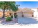 Charming home featuring desert landscaping, a two-car garage and beautiful curb appeal at 14436 W Ventura St, Surprise, AZ 85379