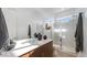 Bright bathroom featuring a glass shower, modern fixtures, and a large vanity at 15044 W Gray Fox Trl, Surprise, AZ 85387