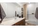Bathroom showcasing a bathtub with white subway tiles and a sleek vanity at 15044 W Gray Fox Trl, Surprise, AZ 85387
