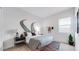 Comfortable bedroom is decorated with stylish bedding and creative wall art at 15044 W Gray Fox Trl, Surprise, AZ 85387