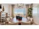 Spacious dining area featuring a large table, modern lighting, and decorative accents at 15044 W Gray Fox Trl, Surprise, AZ 85387
