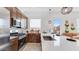 Modern kitchen featuring stainless steel appliances, sleek countertops, and a breakfast bar at 15044 W Gray Fox Trl, Surprise, AZ 85387