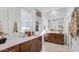 Bright bathroom with double vanities, modern fixtures, and a walk-in shower at 15044 W Gray Fox Trl, Surprise, AZ 85387