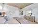 Calm main bedroom with a neutral color palette, decorative wall art, and stylish furnishings at 15044 W Gray Fox Trl, Surprise, AZ 85387