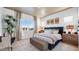 Comfortable bedroom featuring carpet, decorative curtains, plants and an abundance of natural light at 15044 W Gray Fox Trl, Surprise, AZ 85387