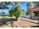 Private backyard featuring a charming landscape design, perfect for relaxation and outdoor gatherings at 15608 N 57Th Dr, Glendale, AZ 85306
