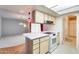 Open floorplan kitchen with ample counter space and stainless steel appliances at 15608 N 57Th Dr, Glendale, AZ 85306