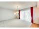 A spacious living room with great wall paper and access to other rooms at 15608 N 57Th Dr, Glendale, AZ 85306