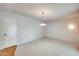 A spacious living room with great wall paper and a well lit room at 15608 N 57Th Dr, Glendale, AZ 85306