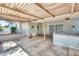 Expansive outdoor patio featuring tiled floors and a shaded area at 15608 N 57Th Dr, Glendale, AZ 85306