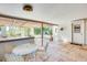 Charming covered patio with tiled floor and an outdoor dining area at 15608 N 57Th Dr, Glendale, AZ 85306