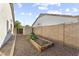 Backyard garden with planter beds and perimeter rock landscaping for low maintenance and water conservation at 15969 W Adams St, Goodyear, AZ 85338