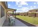 Spacious backyard featuring a well-maintained lawn, covered patio, and low-maintenance landscaping at 15969 W Adams St, Goodyear, AZ 85338