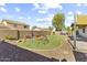 Spacious backyard area with desert landscaping, a play structure, and plenty of room to relax at 15969 W Adams St, Goodyear, AZ 85338