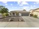 Charming single-story home with a two-car garage, neutral paint, and low-maintenance landscaping at 15969 W Adams St, Goodyear, AZ 85338