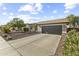 Attractive single-story home featuring a spacious driveway, large garage, and well-kept yard at 15969 W Adams St, Goodyear, AZ 85338