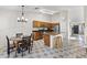 Eat-in kitchen features wooden cabinetry, granite countertops, and stainless steel appliances at 15969 W Adams St, Goodyear, AZ 85338