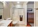 Bright bathroom features a glass-enclosed shower, tiled floors, and modern fixtures for a clean aesthetic at 16469 W Century Plant Dr, Surprise, AZ 85387