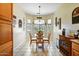 Bright dining nook with a charming bay window and tile flooring at 16469 W Century Plant Dr, Surprise, AZ 85387