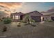 Charming single-story home features a two-car garage, desert landscaping, and tile roof at 16469 W Century Plant Dr, Surprise, AZ 85387