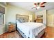Cozy main bedroom with hardwood floors, bay window, and a neutral color scheme at 16469 W Century Plant Dr, Surprise, AZ 85387