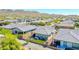 Aerial view of the neighborhood with desert landscaping and mountain views at 16528 W Pedro Ln, Goodyear, AZ 85338