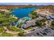 Aerial view of a luxury community with pools, lake access, and lush landscaping, offering a premium outdoor lifestyle at 16528 W Pedro Ln, Goodyear, AZ 85338